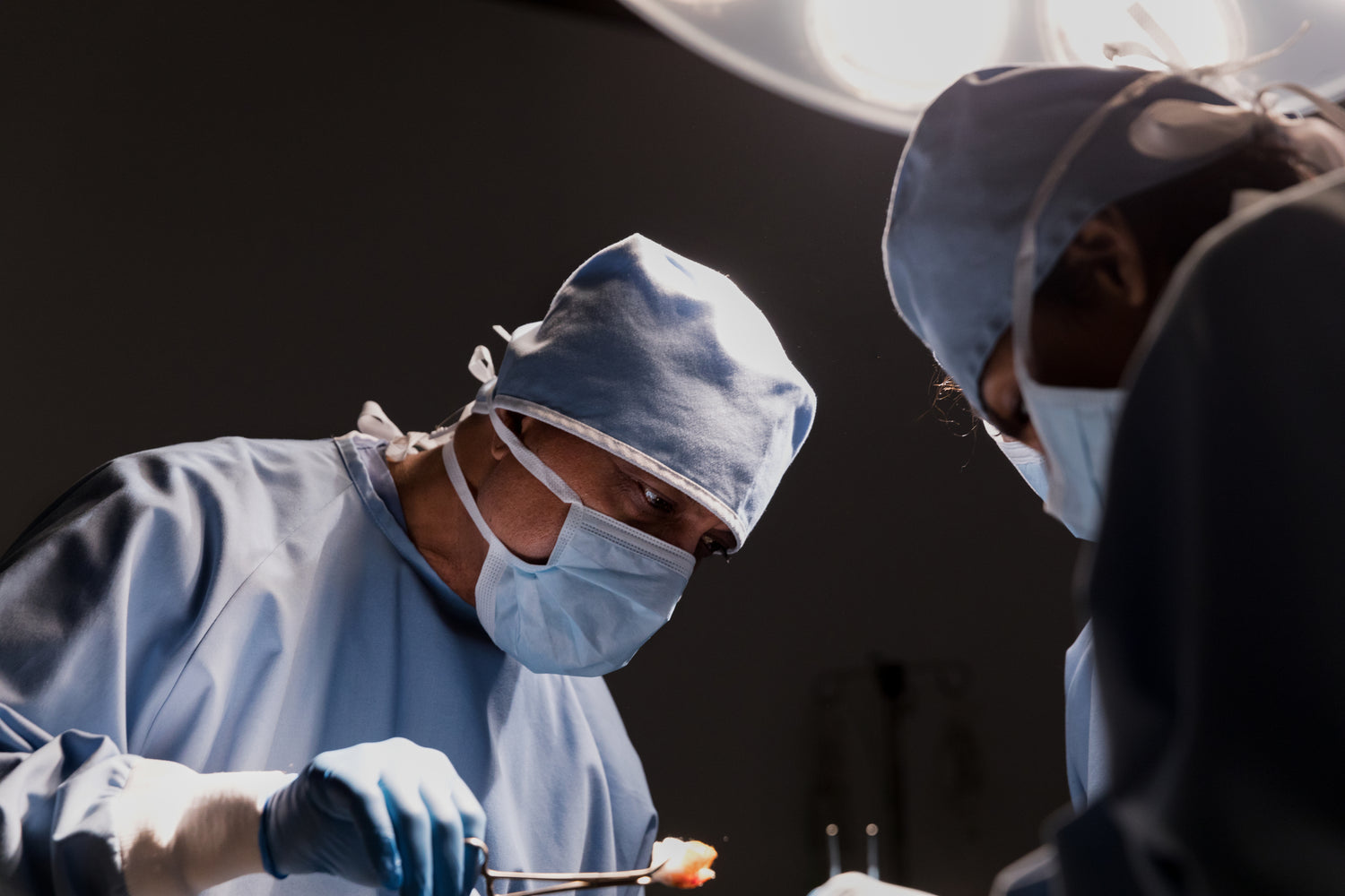 A surgeon at work in an operating theatre